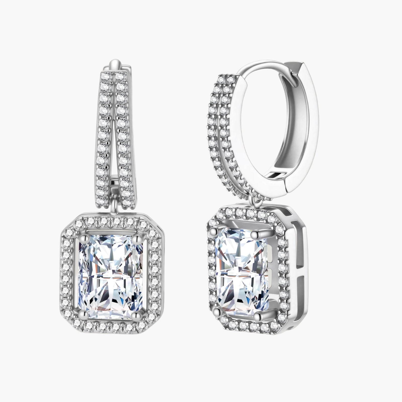 Sterling silver huggie hoops with emerald-cut moissanite drops featuring pavé-set crystals on white background.