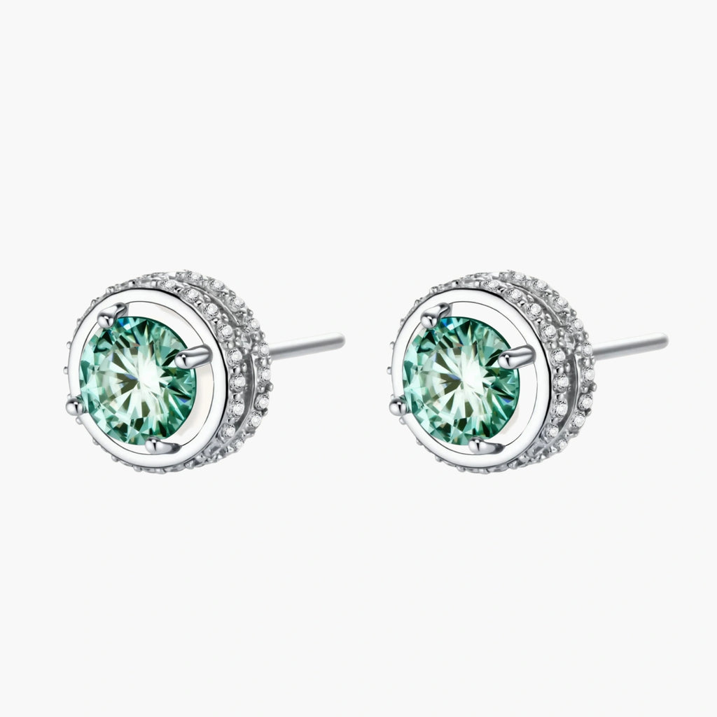 Round green moissanite stud earrings in sterling silver halo settings with brilliant sparkle on white background.